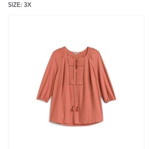 Soft muted orange shade. Pretty on all skin tones. Even my pale pink tones.